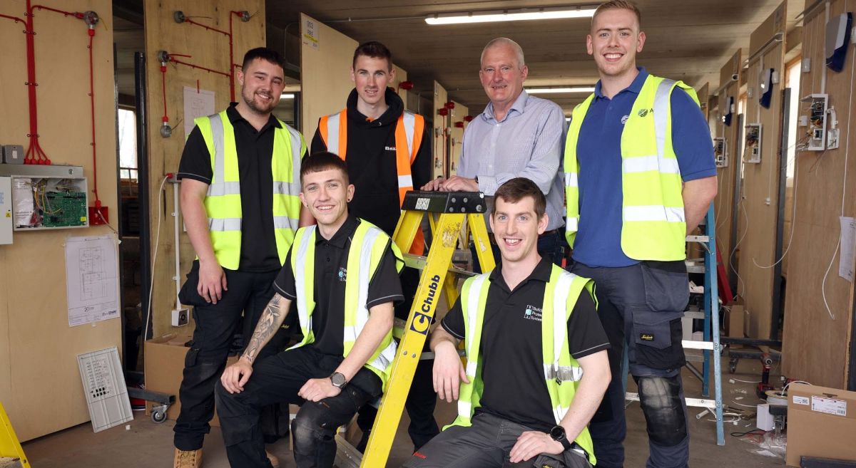 Fire Security Apprentices with Lecturer Robin Hamill at SkillbuildNI